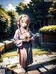 A woman in a kimono standing in a garden.